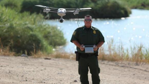 US Border Patrol Agent operates quadcopter drone