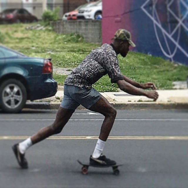 A person riding a skateboard

Description automatically generated