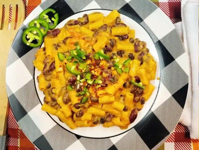 Southwest Mac & Cheese birds eye of plate with jalapeno slices and checker pattern