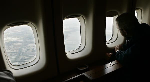 This photo shows President George W. Bush looking out a window of Air Force One as the plane flies over the flooded streets of New Orleans, Louisiana three days after Hurricane Katrina devastated the city and the Gulf Coast. This photo shows President George W. Bush looking out a window of Air Force One as the plane flies over the flooded streets of New Orleans, Louisiana three days after Hurricane Katrina devastated the city and the Gulf Coast.