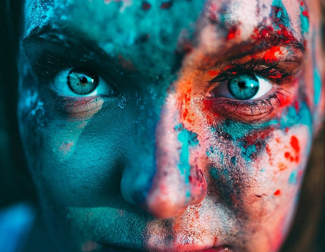 portrait photography of woman with face paint