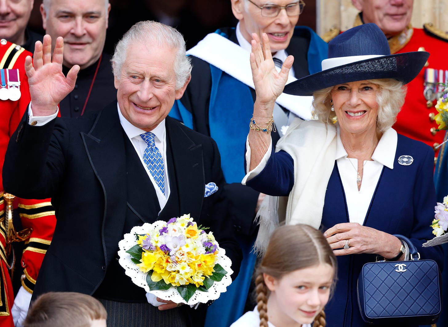 King Charles and Queen Camilla waving after Maundy Thursday service