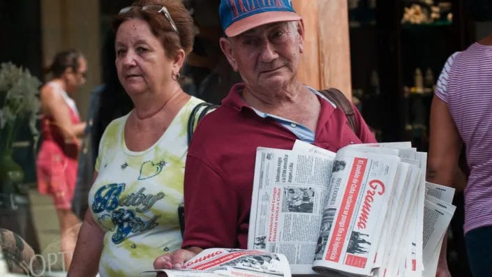 Newspaper vendor in Cuba