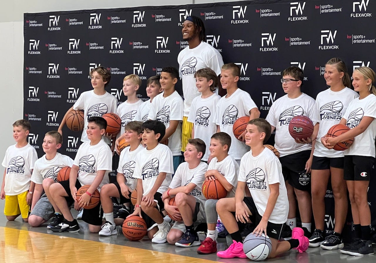 Myles Turner took a group photo during each rotation, plus an individual picture with each camper.