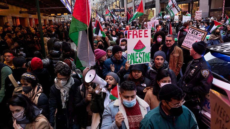 Pro-Palestinian demonstrators in New York City demand that Christmas not be celebrated during Israel's continued bombing of the Gaza Strip on Monday. Photo by Andrew Lichtenstein/Corbis via Getty Images