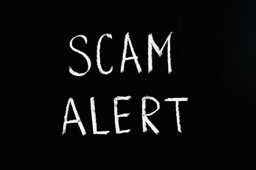 Free Scam Alert Letting Text on Black Background Stock Photo