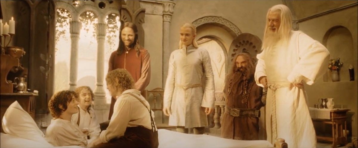 Merry, Pippin, Aragorn, Legolas, Gimli, and Gandalf surround Frodo