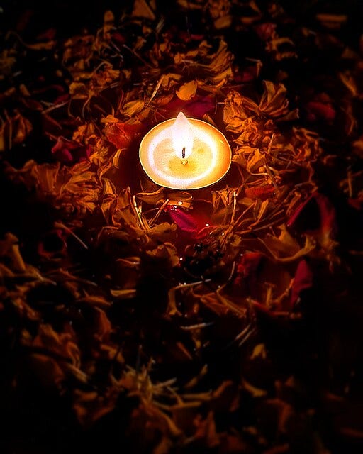 image: a lit lamp for Diwali