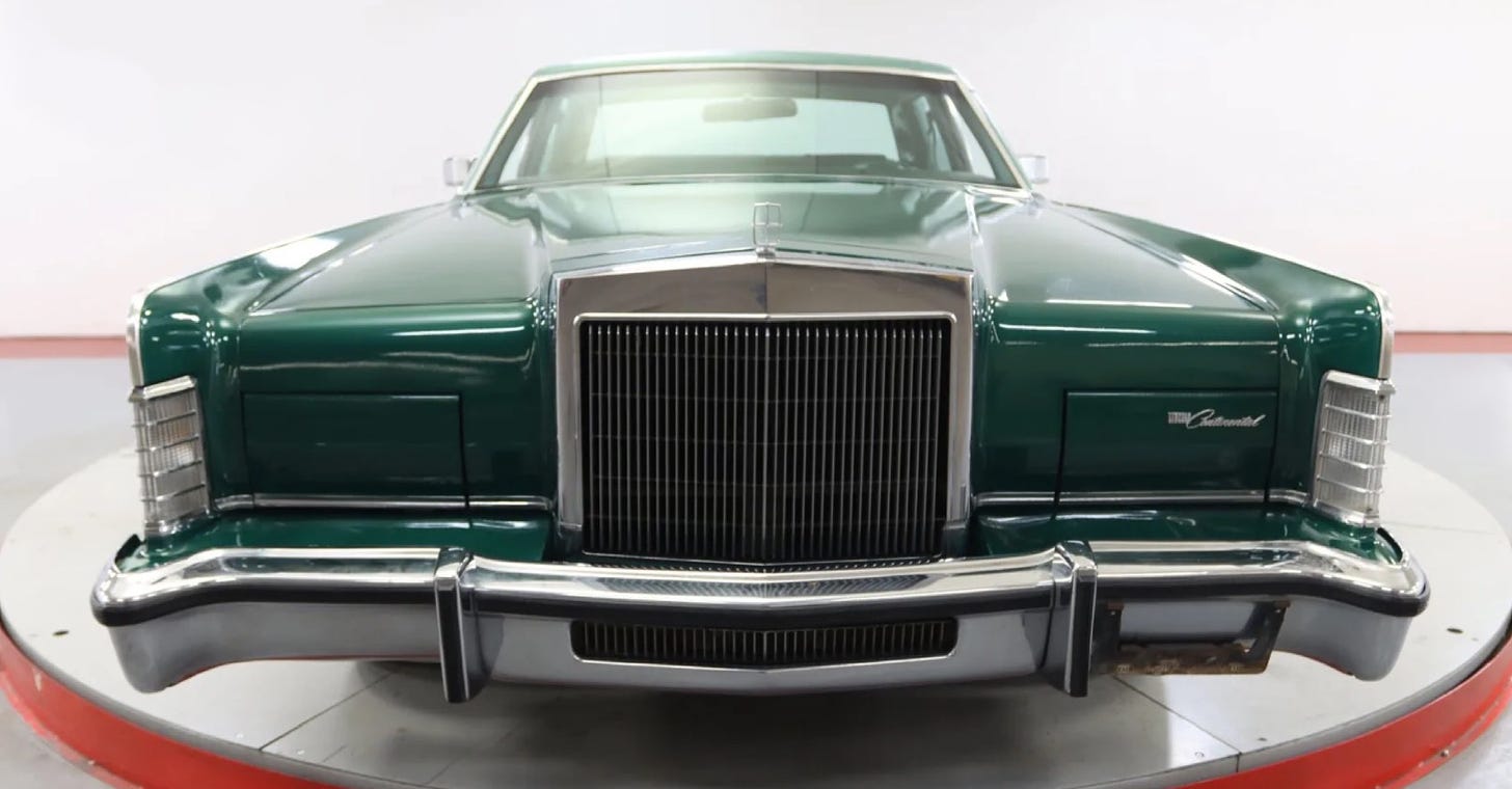 A front-on view of a Jade Lincoln Continental.