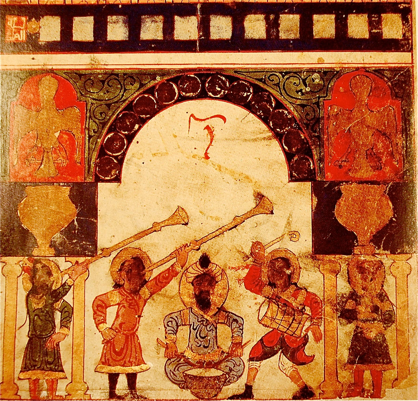 It is an old Indian frieze. The colours are different spectras of orange, brown, beige and gold. It is an old water clock that depicts men in turbans playing cornets and trumpets, whilst a man in the middle plays a type of drum. The background is ornate decoration with an arc in the centre.