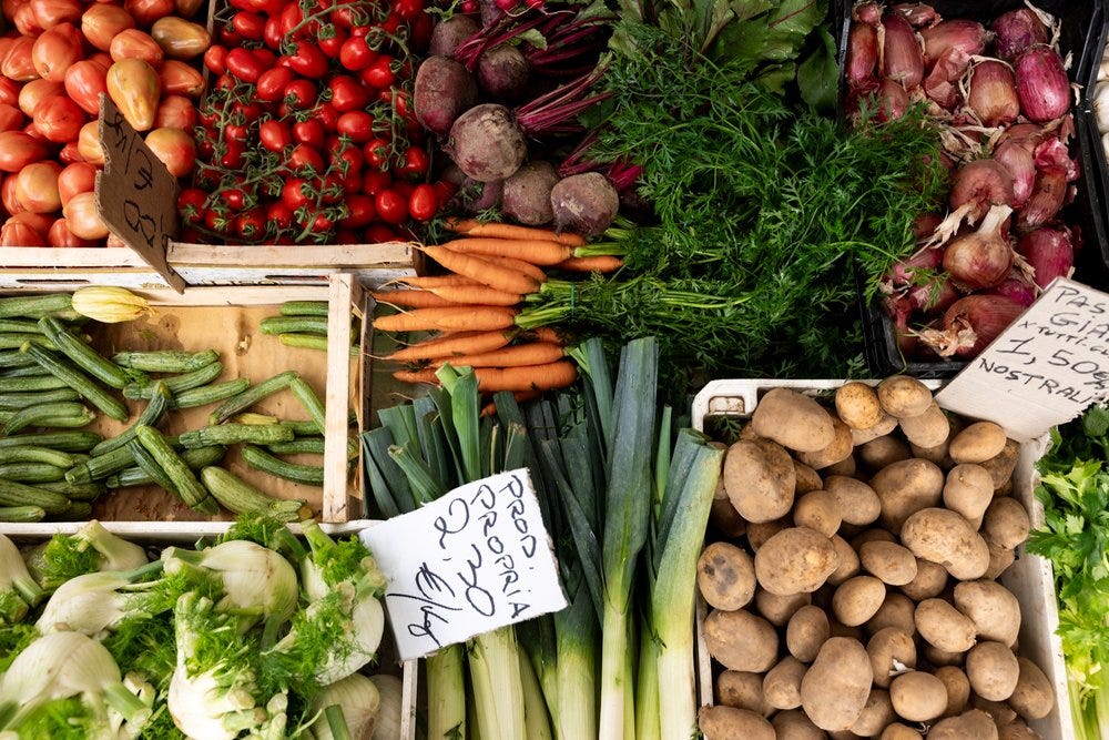 A birds eye view of different vegetables at a market stand