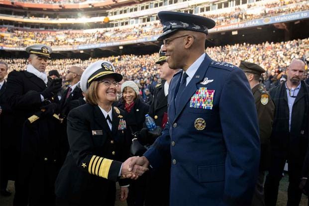 Gen. CQ Brown, Jr., Chairman of the Joint Chiefs, greets Adm. Lisa Franchetti, Chief of Naval Operations