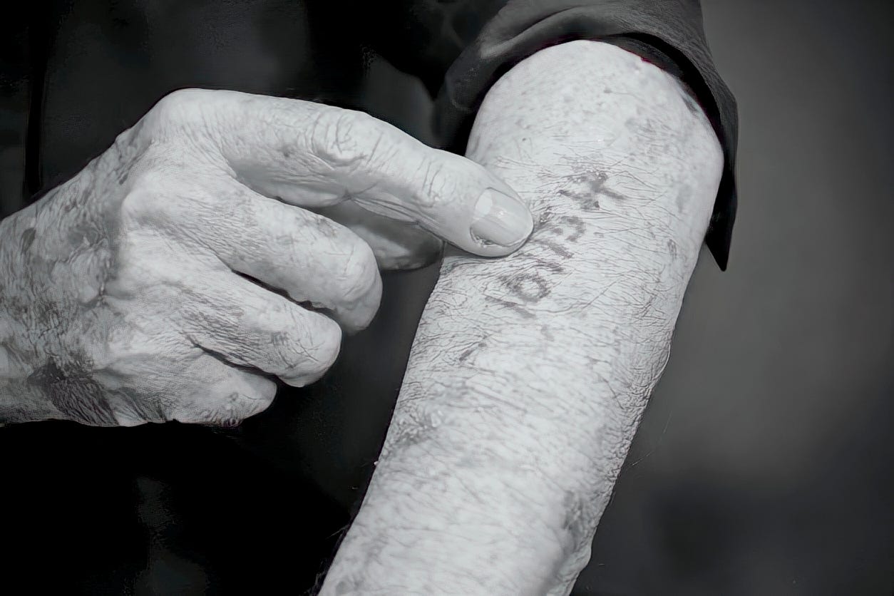 Man's arm with serial number tattoo