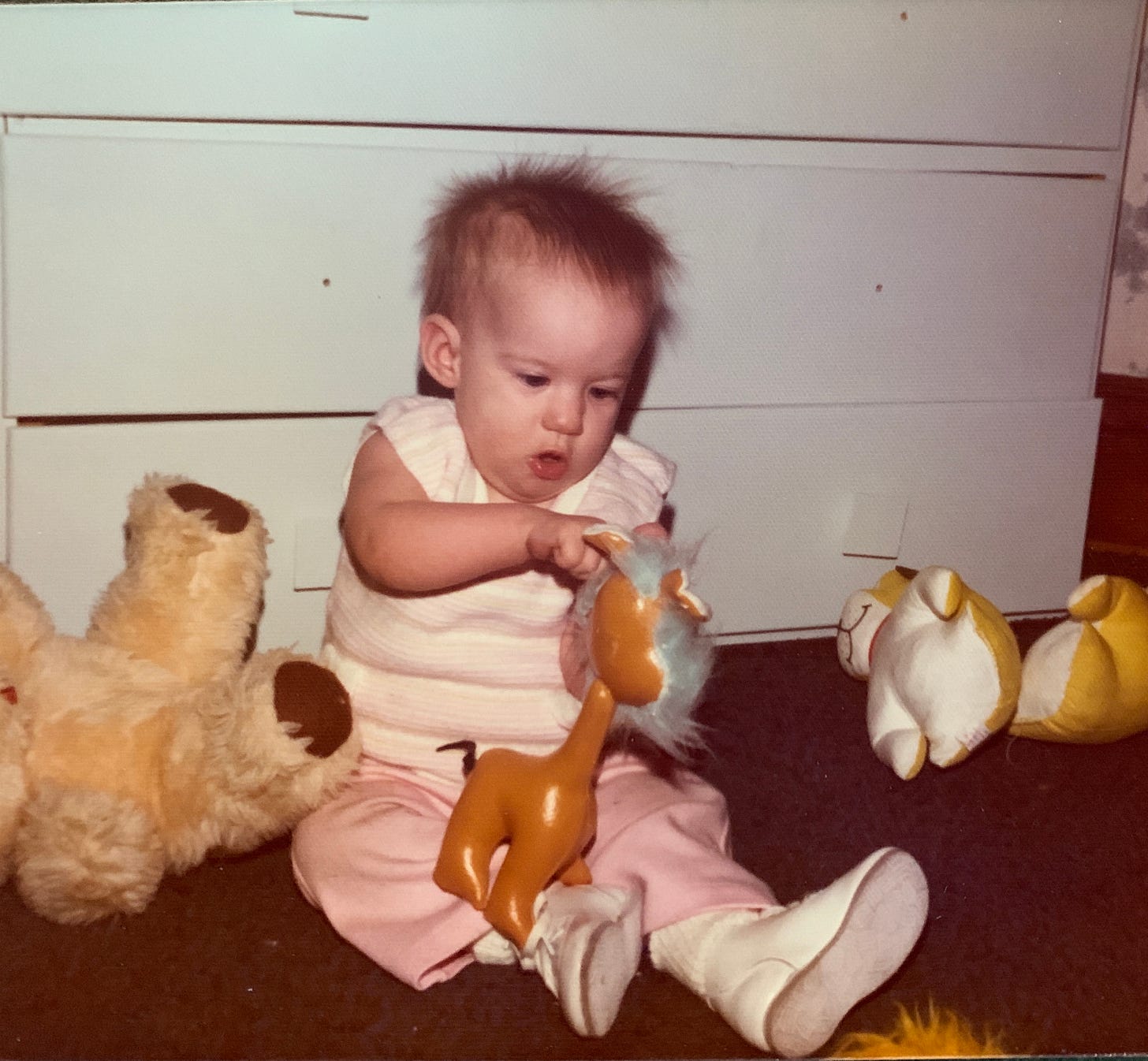 Little Kimmy playing with the stuffed animals she loved. 