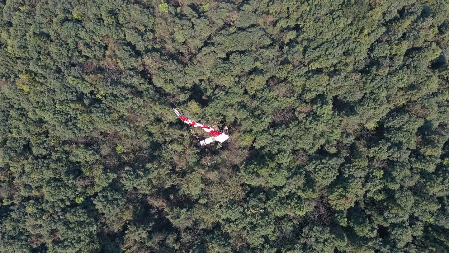 One of the Long March 3B/E’s boosters after touching down from a parachute-controlled descent.