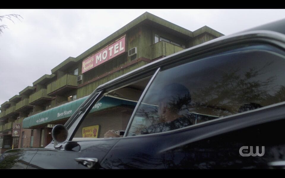 Supernatural Winchester borothers Impala pulling up to Rooster Sunrise motel