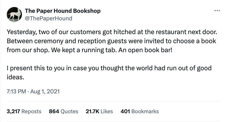 A tweet by @thepaperhound describing how at a wedding reception, guests were invited to stop into the book shop and choose a book for free as a gift from the couple