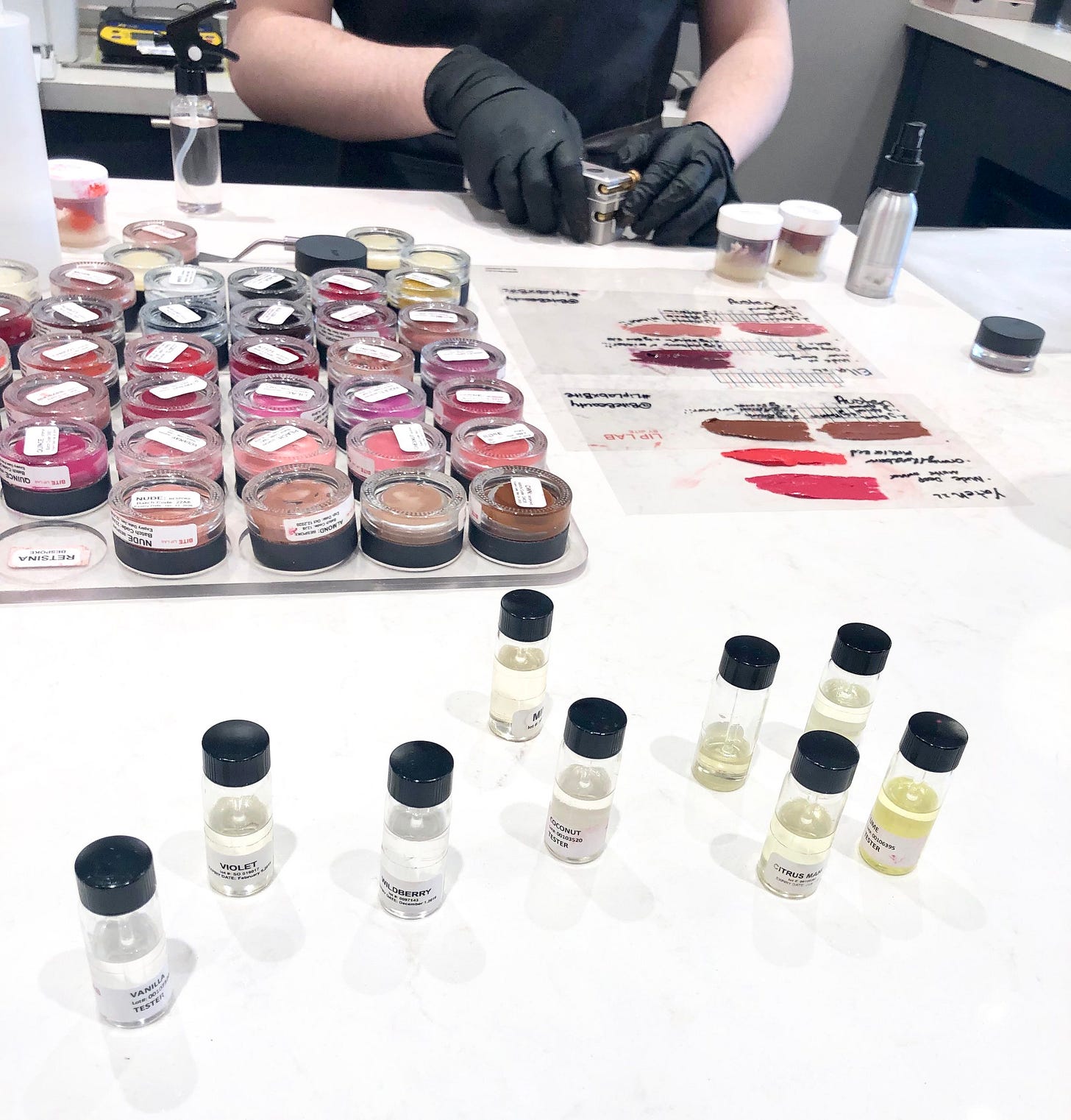The colourful jars are the lipstick pigments that the Colour Artist mixes together to create your bespoke lipstick and the tiny jars with liquid in them are scents that you can choose to add to your lipstick as well. The colourful jars are the lipstick pigments that the Colour Artist mixes together to create your bespoke lipstick and the tiny jars with liquid in them are scents that you can choose to add to your lipstick as well.
