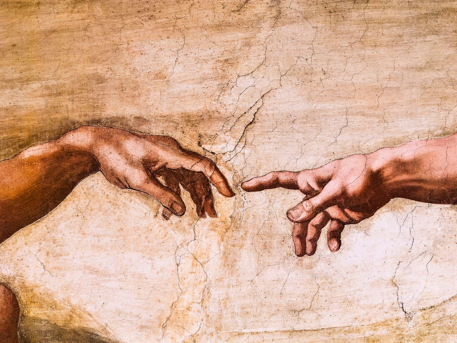 Stuart Dee / Getty Images: Close up of God and Adam's hands.