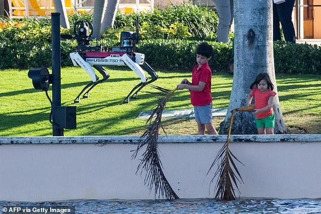 A robot Secret Service dog in the background is a reminder of how their lives are changing