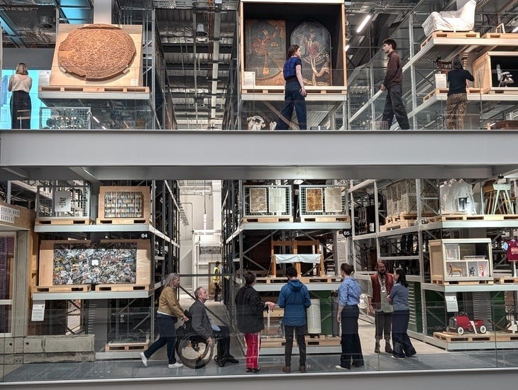 People wandering among a museum's collections