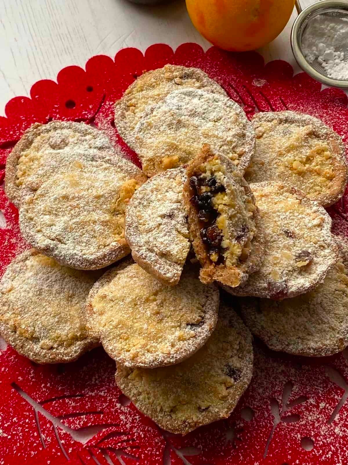 Mincemeat Streusel Pies on a red place mat.