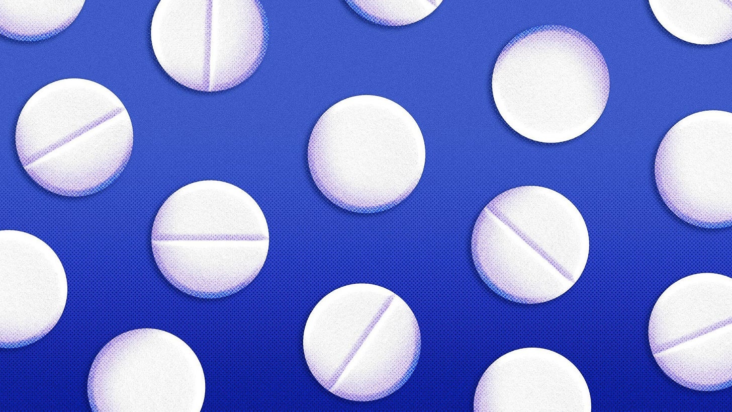 Illustration of a pattern of pills on a blue background.