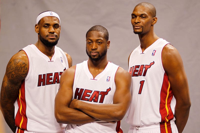 LeBron James, Dwyane Wade, and Chris Bosh pose for the camera during Miami Heat media day.