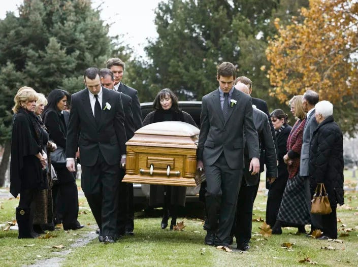 Homicides and the opioid epidemic both contribute to the rising U.S. death rates. <a href="https://www.gettyimages.com/detail/photo/people-at-a-funeral-royalty-free-image/104302939?phrase=U.S.+cemetery&adppopup=true" rel="nofollow noopener" target="_blank" data-ylk="slk:Rubber Ball Productions/Brand X Pictures via Getty Images;elm:context_link;itc:0" class="link ">Rubber Ball Productions/Brand X Pictures via Getty Images</a>