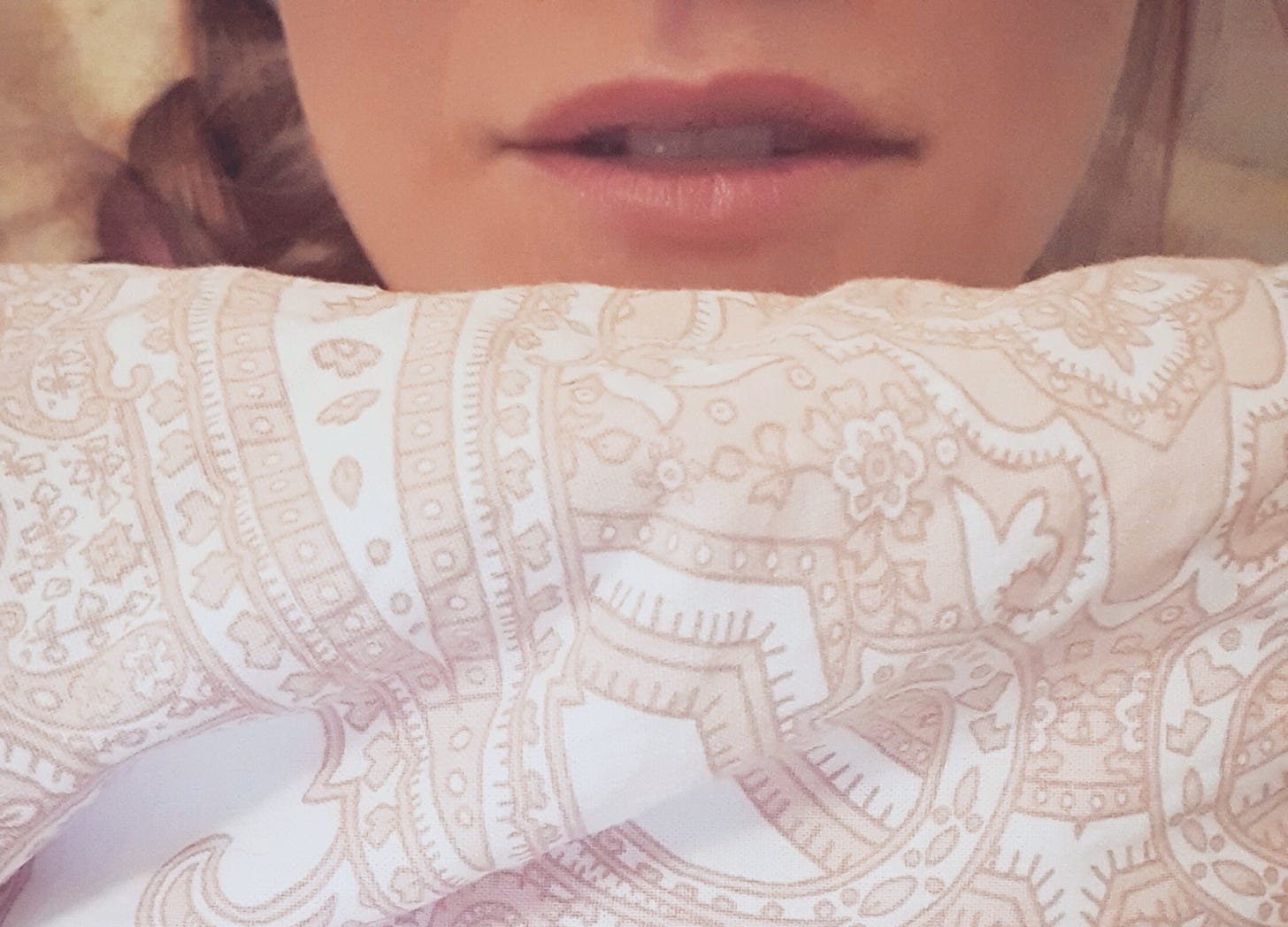 Female sensual lips under the blanket