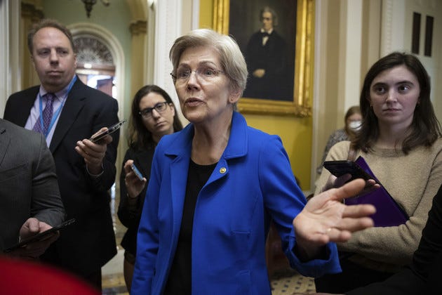 Sen. Elizabeth Warren (D-Mass.) speaks with reporters outside a Senate Democratic Caucus policy luncheon at the U.S. Capitol April 26, 2023. Sen. Elizabeth Warren (D-Mass.) speaks with reporters outside a Senate Democratic Caucus policy luncheon at the U.S. Capitol April 26, 2023.