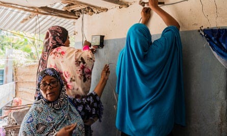 Three women install solar power 