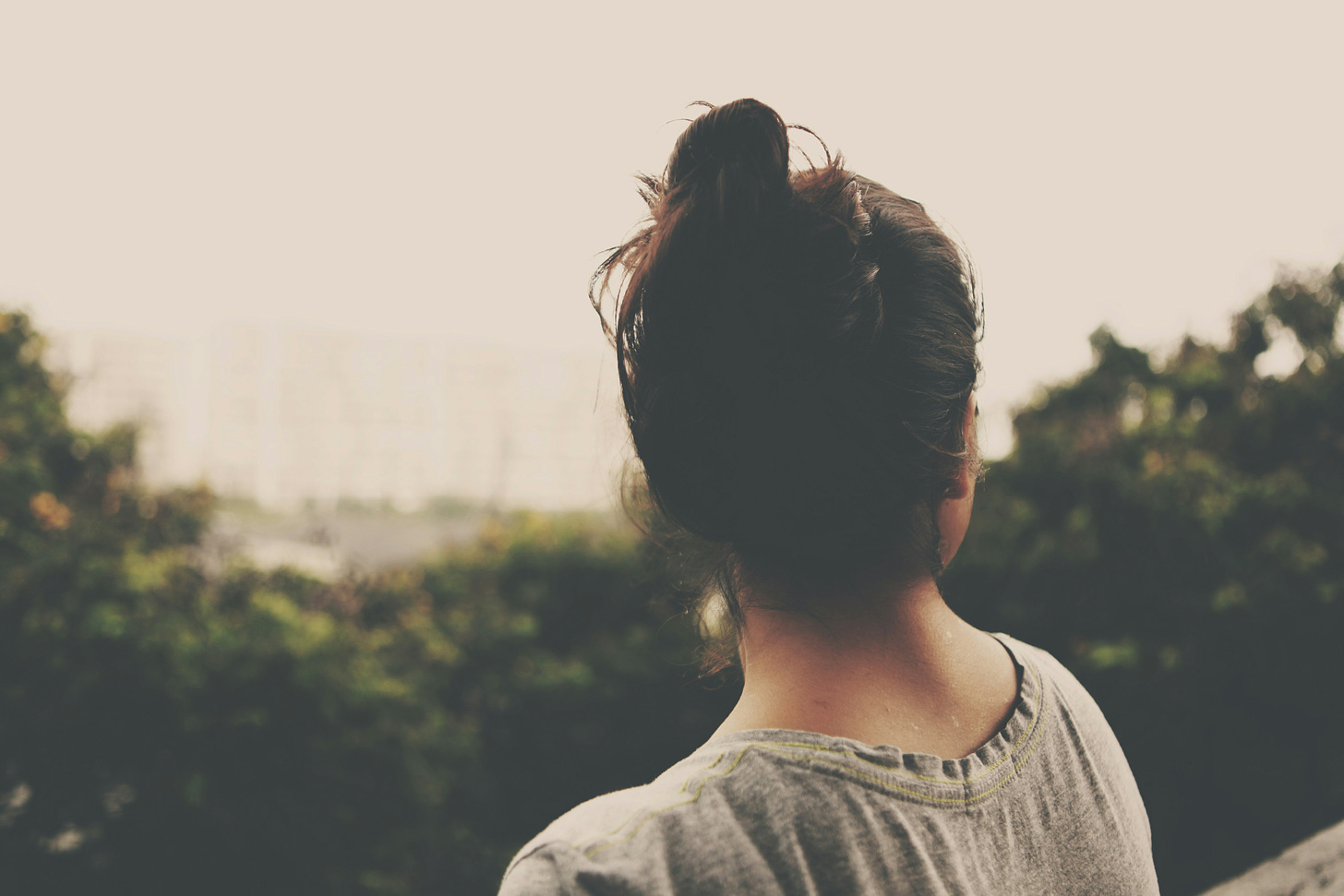 Photo of Young Woman Staring at a Forest