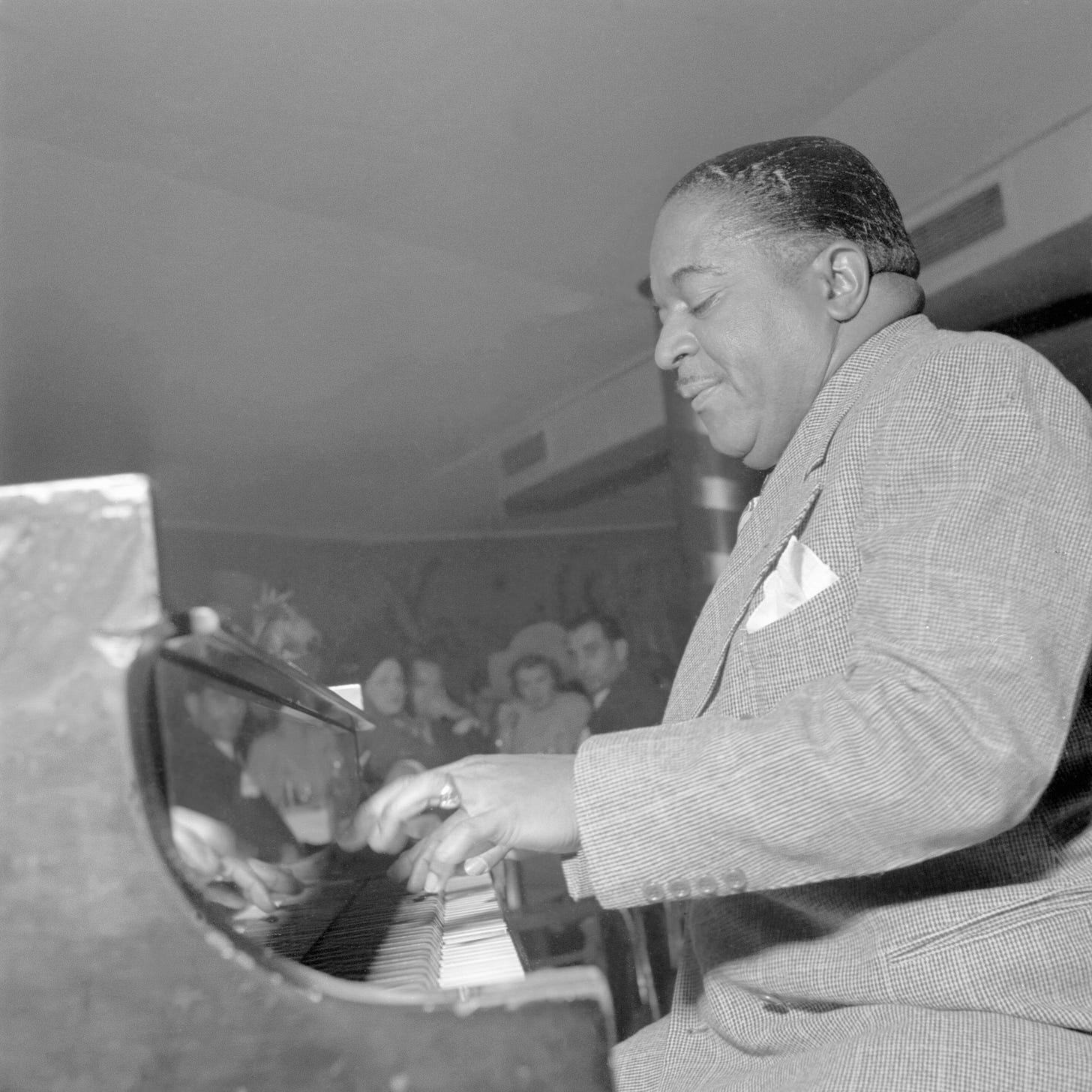 Jazz piano player Pete Johnson plays with his jazz orchestra in a New York City club in the fifties. Jazz piano player Pete Johnson plays with his jazz orchestra in a New York City club in the fifties.