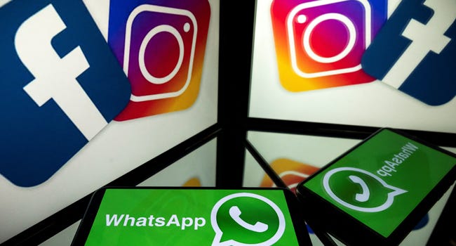 This file photo taken on October 5, 2020, shows logos of US social networks Facebook, Instagram and mobile messaging service WhatsApp on the screens of a smartphone and a tablet in Toulouse, southwestern France. Lionel BONAVENTURE / AFP