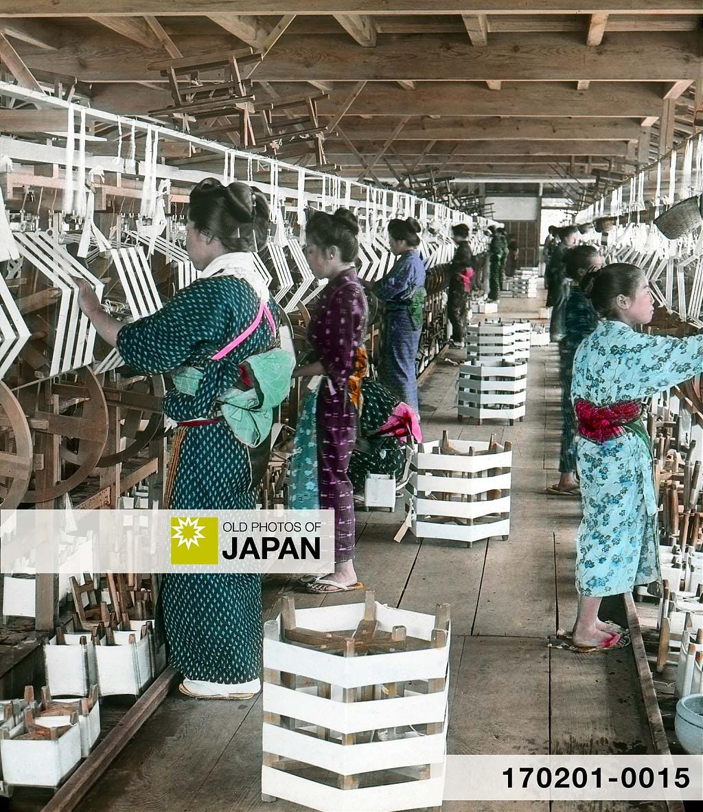 Japanese women and girls reeling silk at a factory, 1900s