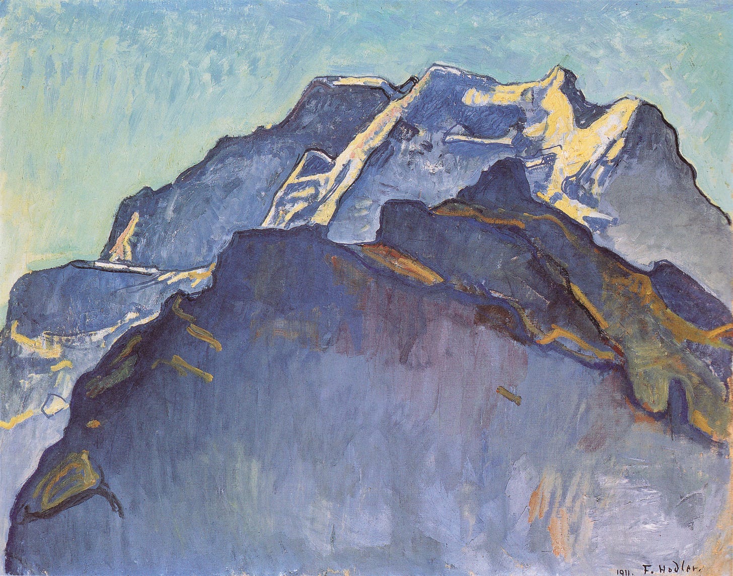 A series of craggy mountains in slate blues are topped and edged with gold: snow in sunlight. The sky behind is the color of cornflowers. 