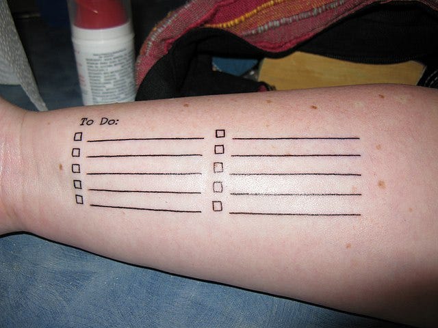 Photograph of a tattoo in the form of a to do list, by Rob and Stephanie Levy via Wikimedia