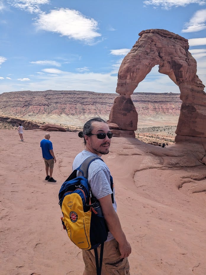 Clark in front of Delicate Arch in Arches National Park