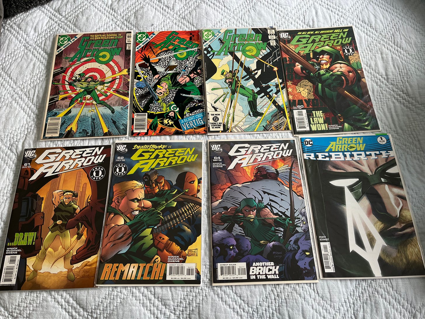 Eight issues of Green Arrow comics ranging from the 1980s to 2016