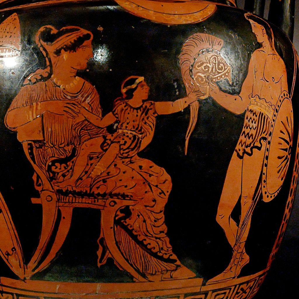 Close up of a Red figure vase with a woman on the left holding a child in her lap looking at his father on the right holding a helmet
