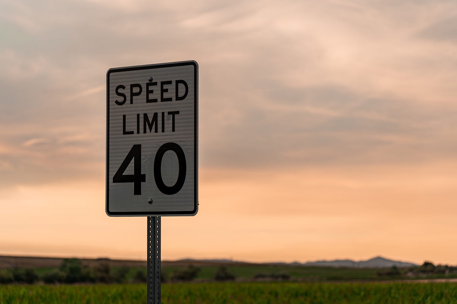 speed limit 40 sign with sunset background