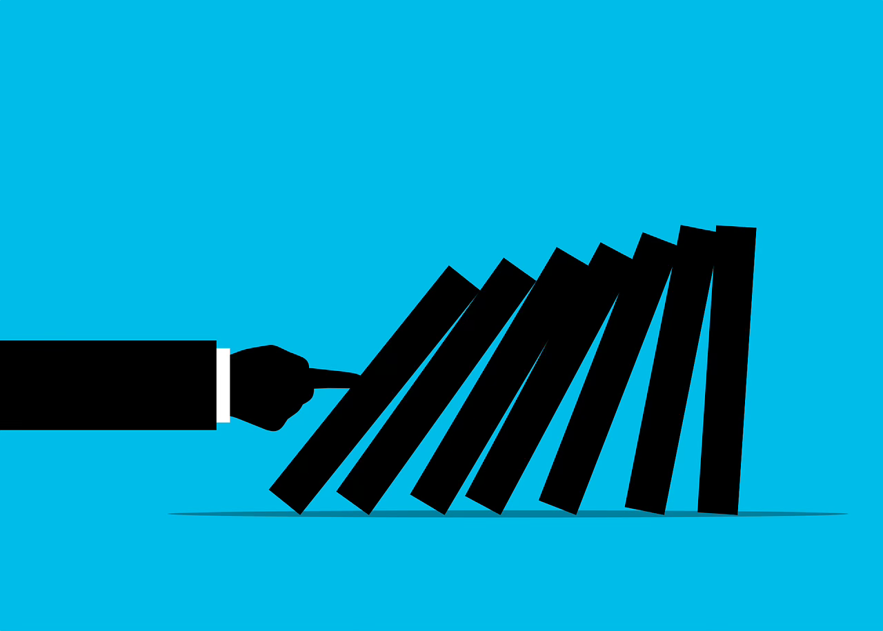 illustration on bright blue background of a black and white arm pointing to dominos and knocking over the first few in a series of 7 to show the "domino effect"