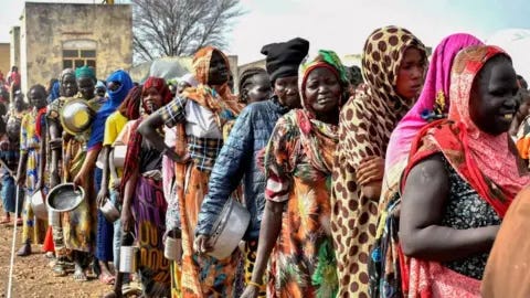 Reuters Women who fled war in Sudan queue for food rations