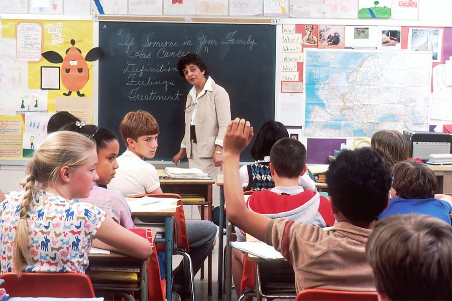 Teacher teaching students