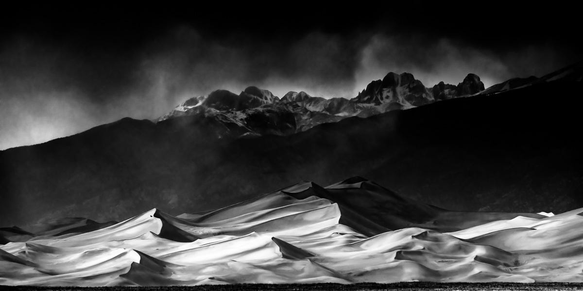 black and white landscape image with extremely deep shadow
