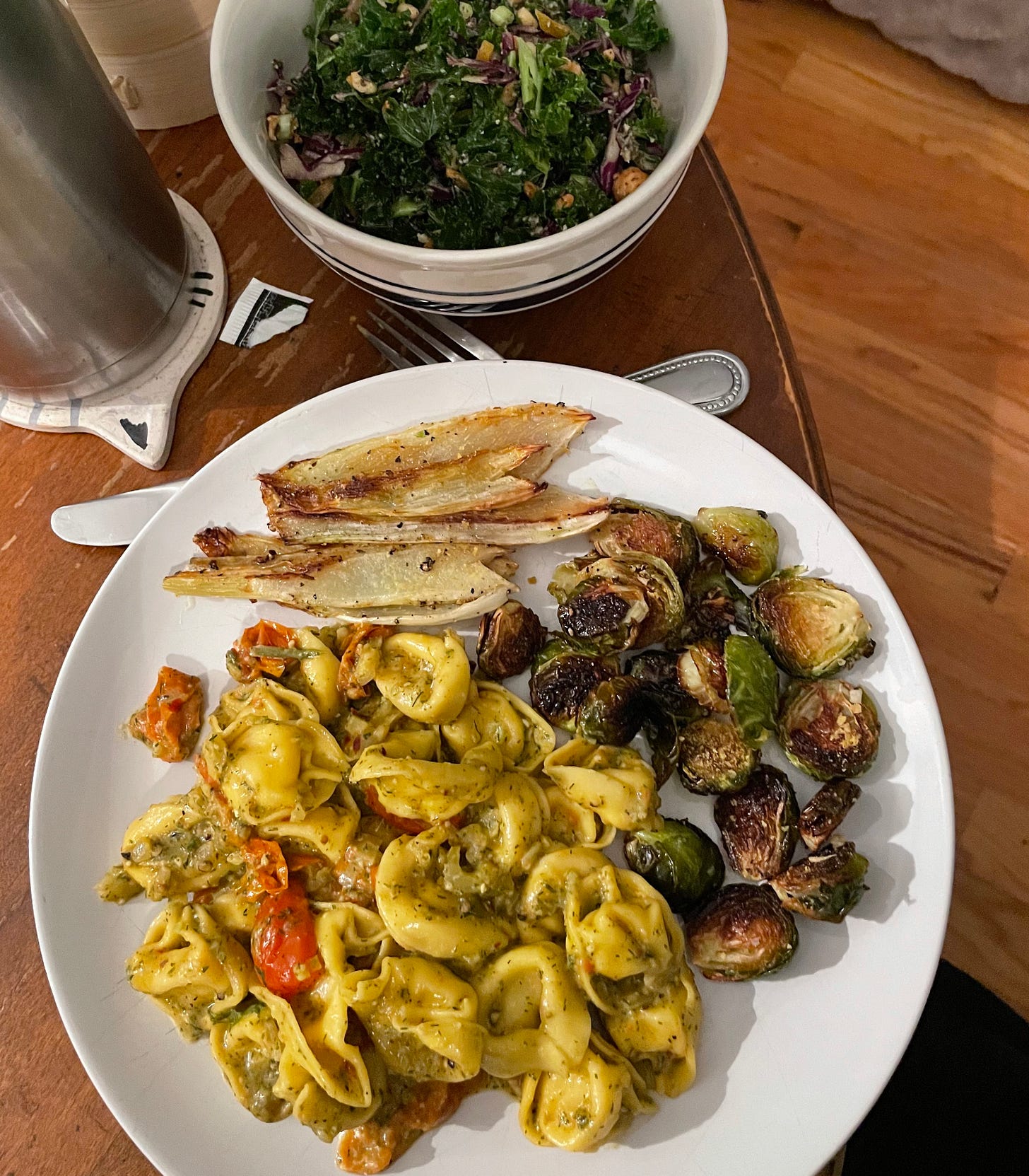 tortellini in tomato and fennel pesto sauce w kale salad and roasted fennel + brussels