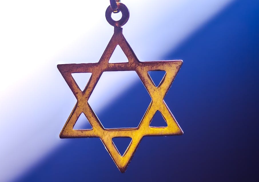 a star of david hanging from a chain