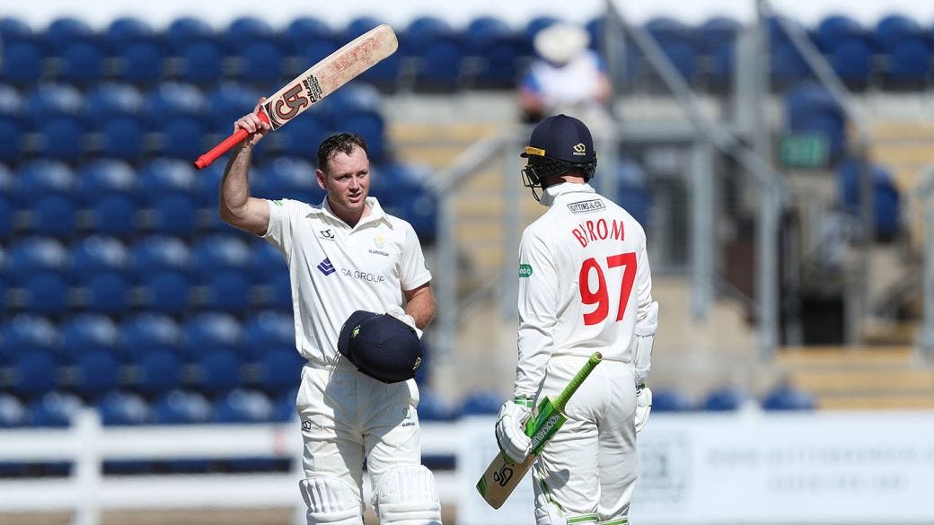 Colin Ingram after scoring a century as team-mate Eddie Byrom looks on