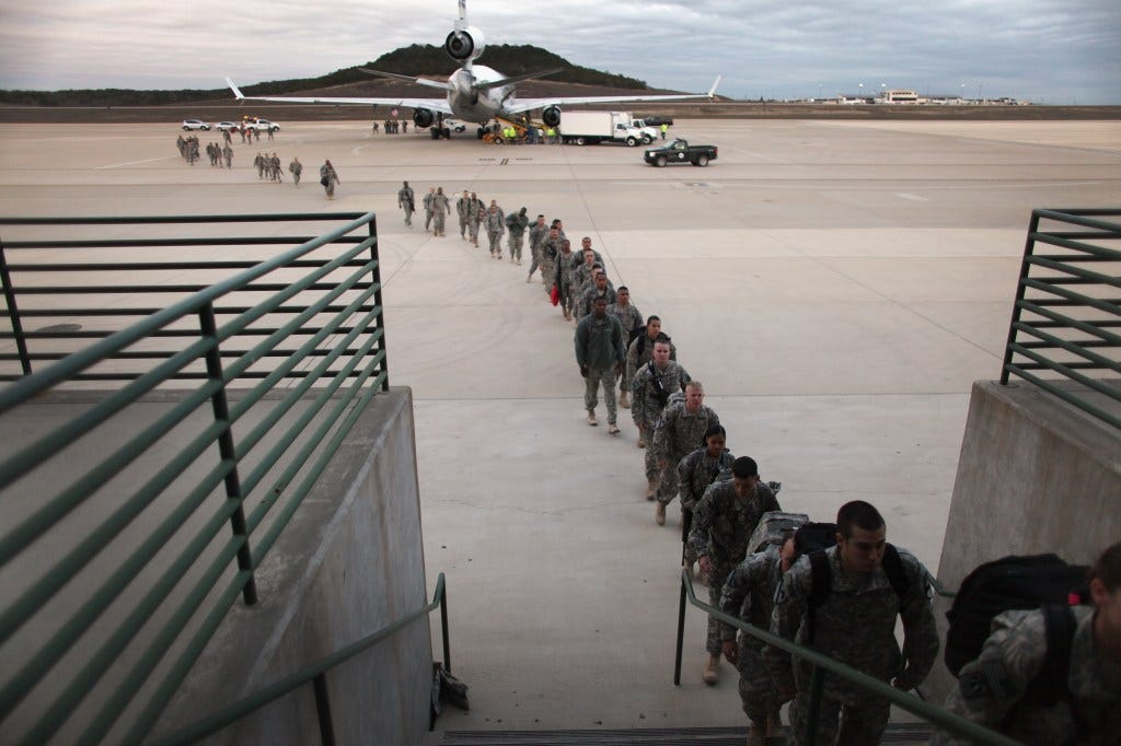 troops exiting an aircraft 